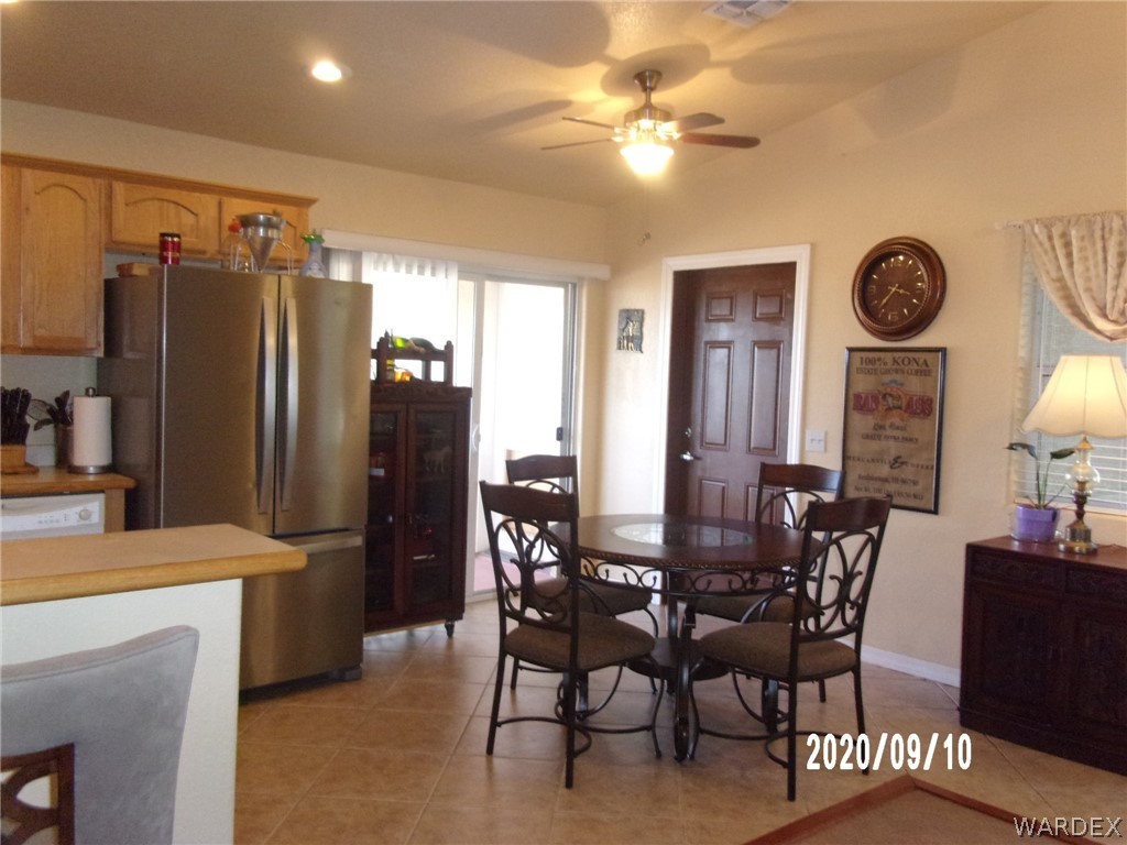 303 Bouse Road Golden Valley, AZ 86413 - Photo 21 of 42 a view of a dining room with furniture