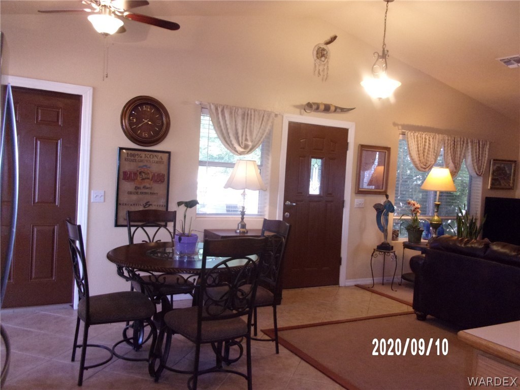 303 Bouse Road Golden Valley, AZ 86413 - Photo 25 of 42 a view of a dining room with furniture and chandelier