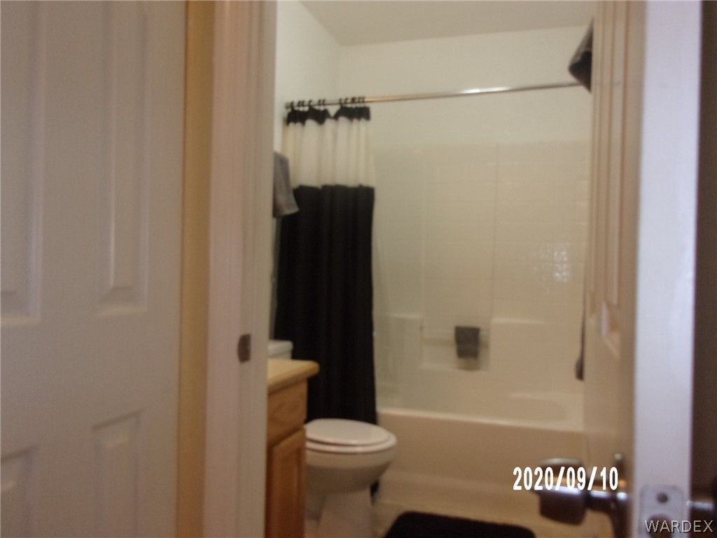 303 Bouse Road Golden Valley, AZ 86413 - Photo 29 of 42 a bathroom with a shower and a toilet