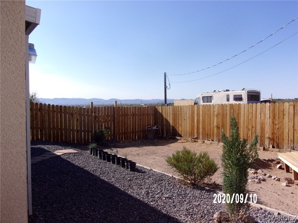 303 Bouse Road Golden Valley, AZ 86413 - Photo 35 of 42 a view of a balcony with wooden fence