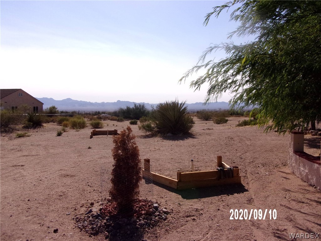 303 Bouse Road Golden Valley, AZ 86413 - Photo 42 of 42 a view of a lake with mountain