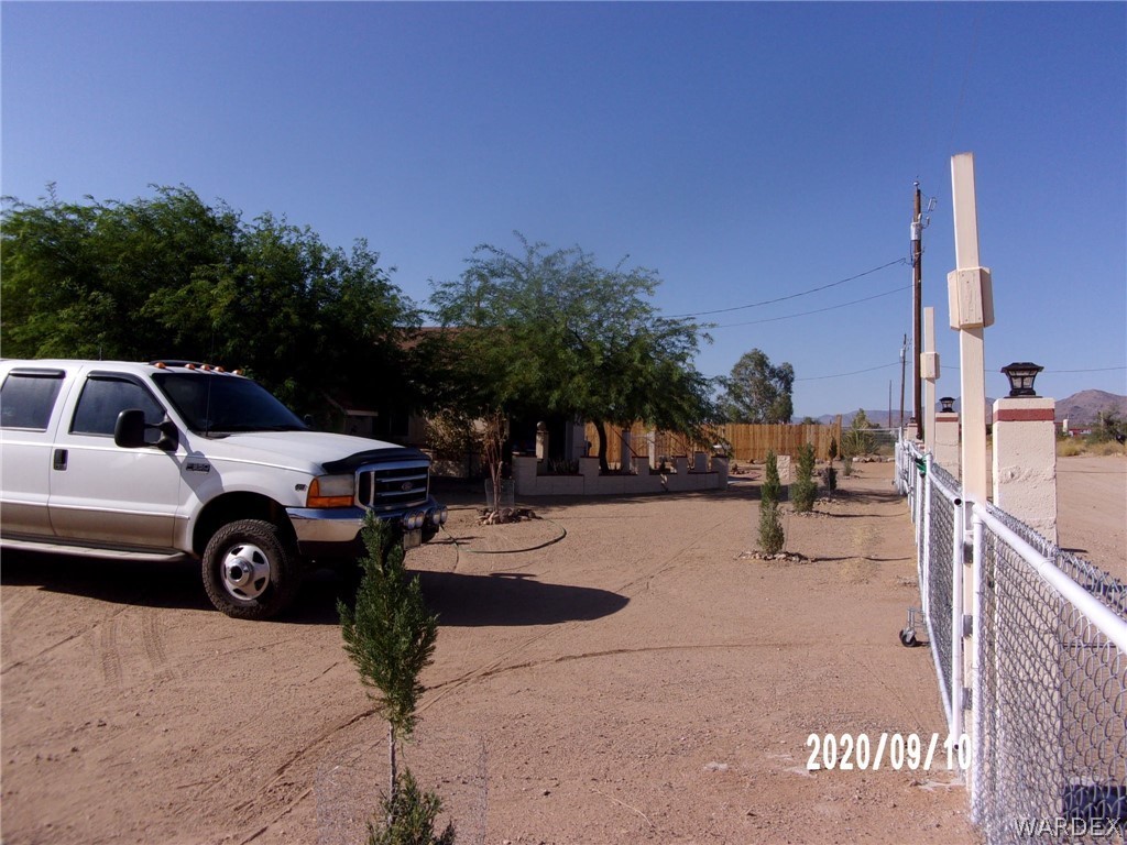 303 Bouse Road Golden Valley, AZ 86413 - Photo 6 of 42 a view of street with parked cars