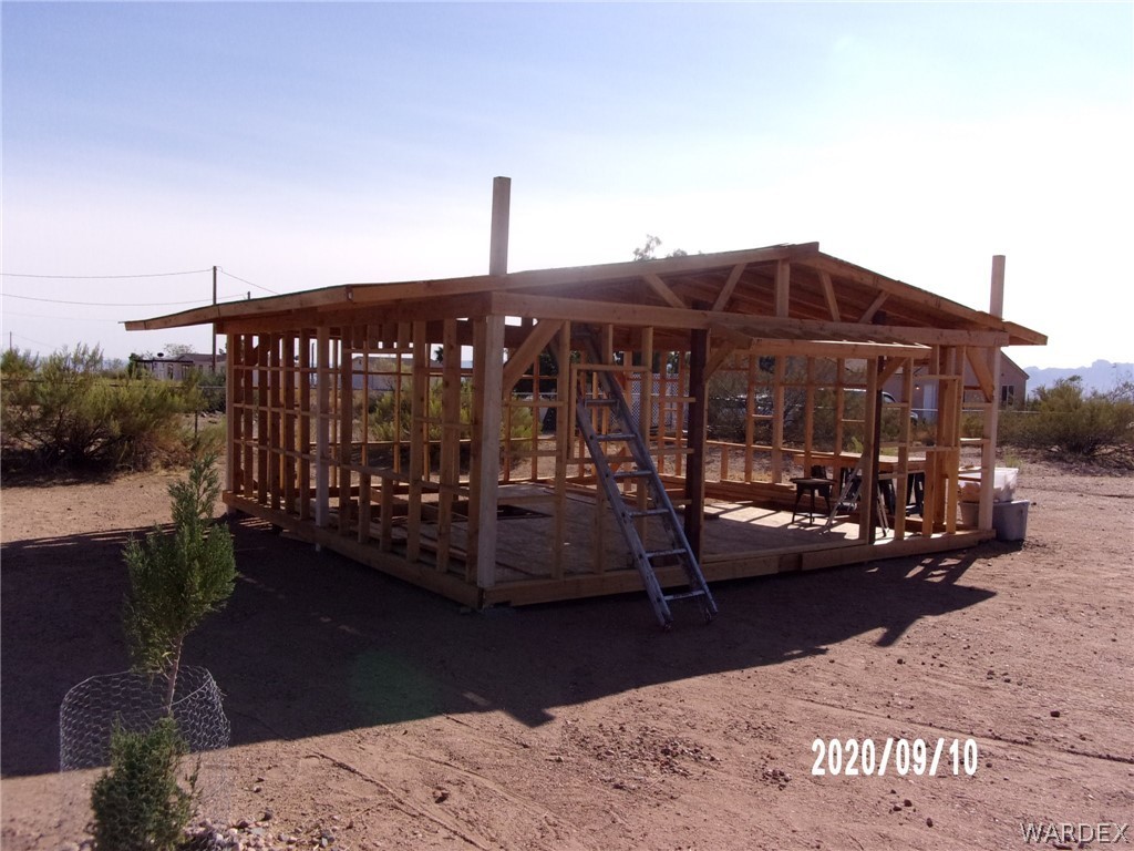 303 Bouse Road Golden Valley, AZ 86413 - Photo 8 of 42 a view of a patio with a table and chairs