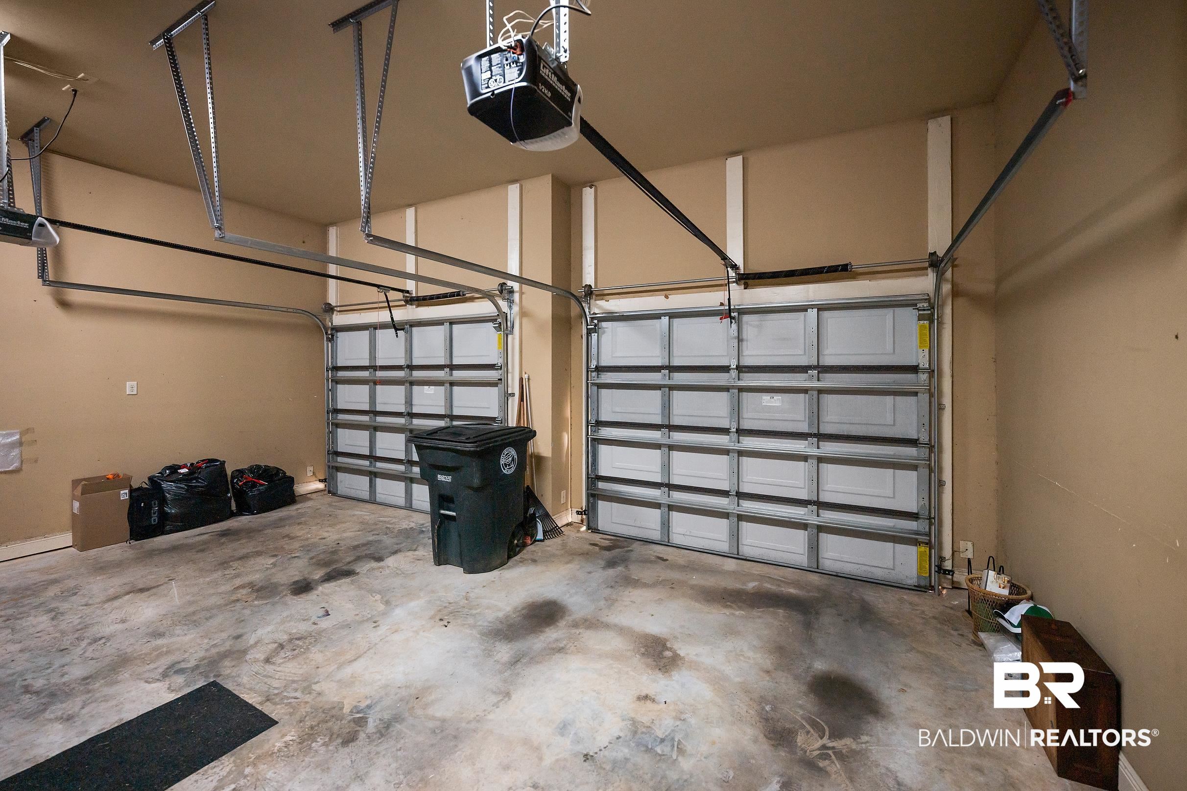 313 Pecan Ridge Boulevard Fairhope, AL 36532 - Photo 49 of 51 Two-car garage with concrete flooring and beige walls