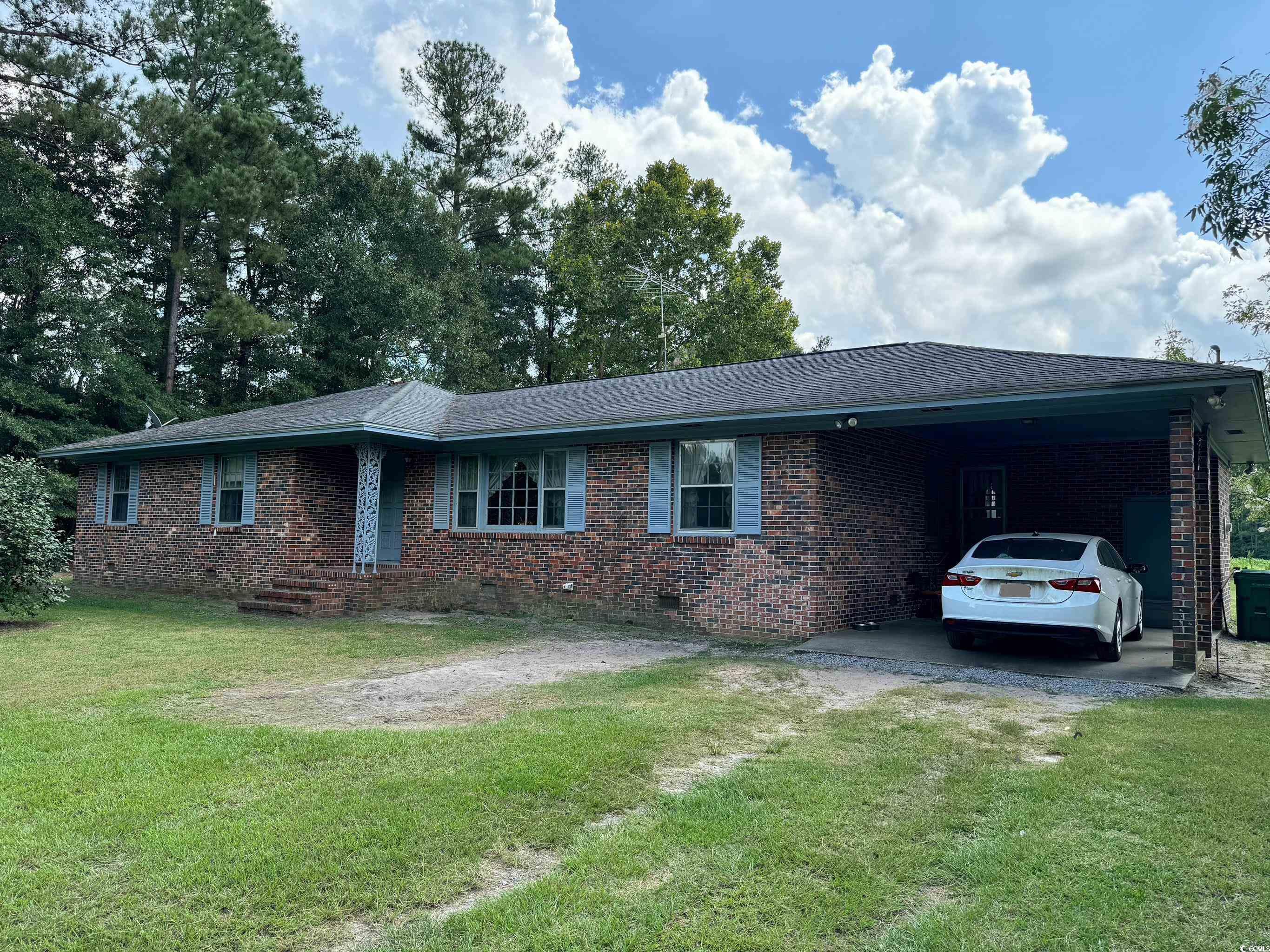 347 Harpers Road Marion, SC 29571 - Photo 1 of 35 Ranch-style home featuring a front lawn and a carport