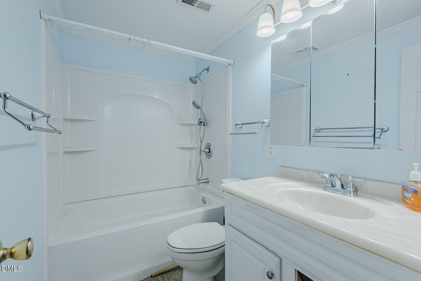 1302 Blacksmith Road Efland, NC 27243 - Photo 27 of 46 a bathroom with a sink toilet vanity and shower