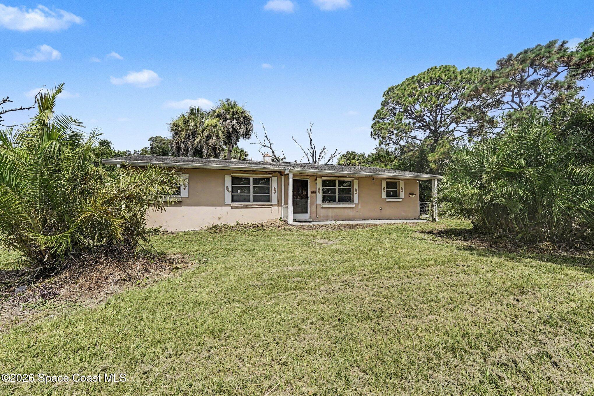 1406 Northeast Tropicana Road Palm Bay, FL 32905 - Photo 2 of 37 004_file_6372