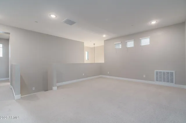 a bathroom with a double vanity sink mirror and shower