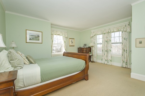 230 Buckminster Road Brookline, MA 02445 - Photo 13 of 19 a bed sitting in a bedroom next to a window