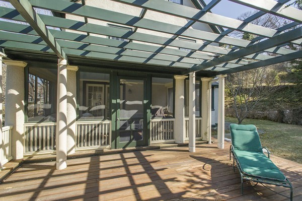 230 Buckminster Road Brookline, MA 02445 - Photo 19 of 19 a view of a porch with furniture and a yard
