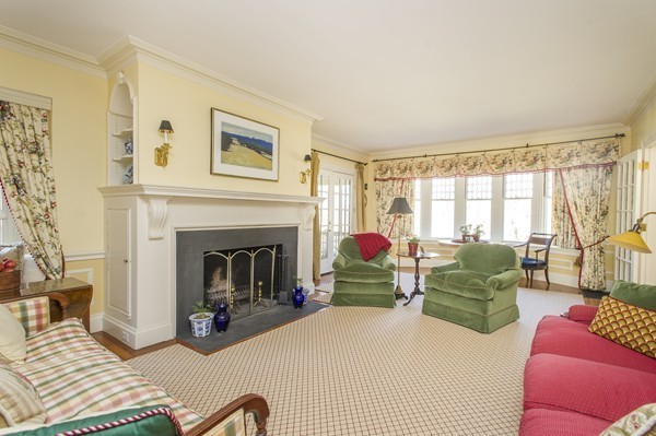 230 Buckminster Road Brookline, MA 02445 - Photo 3 of 19 a living room with furniture and a fireplace