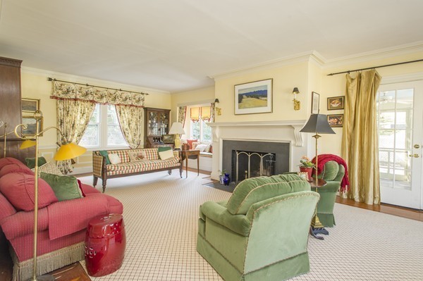 230 Buckminster Road Brookline, MA 02445 - Photo 4 of 19 a living room with furniture and a fireplace