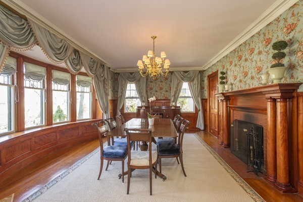 230 Buckminster Road Brookline, MA 02445 - Photo 6 of 19 a dining room with furniture a chandelier and a rug