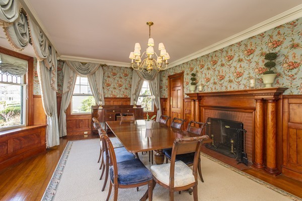 230 Buckminster Road Brookline, MA 02445 - Photo 7 of 19 a view of a dining room with furniture a chandelier and wooden floor