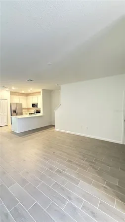a view of a livingroom with wooden floor
