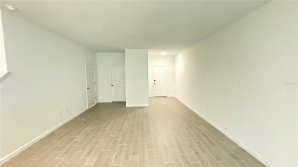 a view of an empty room and window