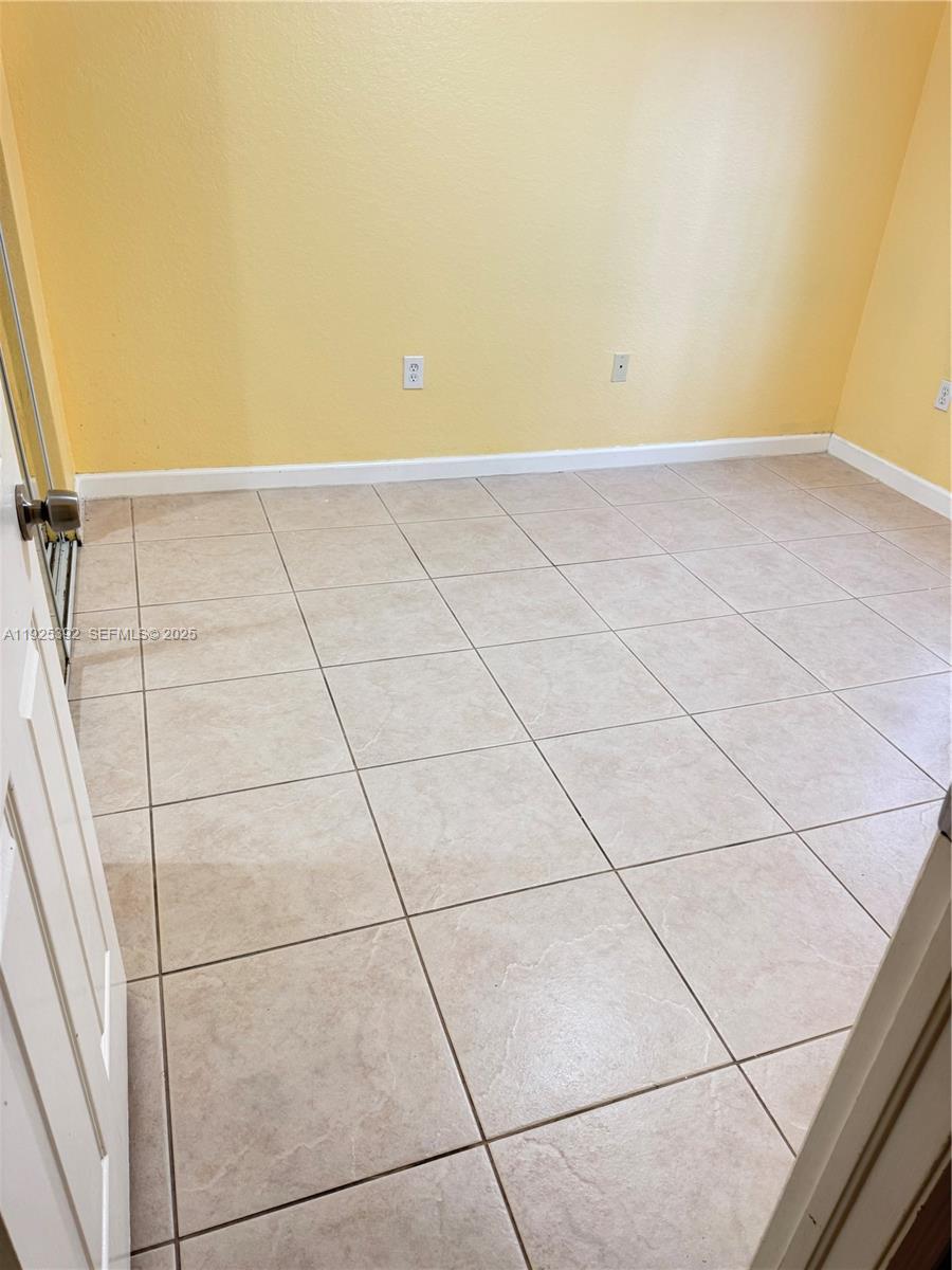 23953 Southwest 108th Court Homestead, FL 33032 - Photo 13 of 25 a view of an empty room with a window