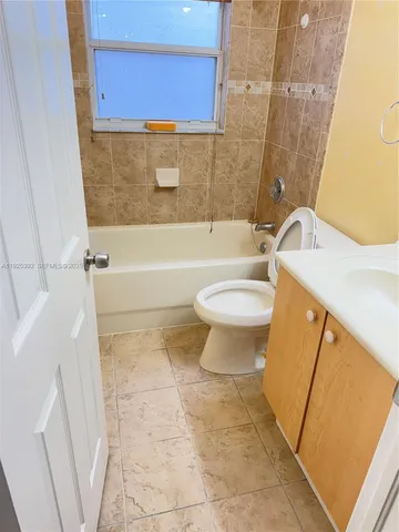 a bathroom with a sink a toilet and a bathtub