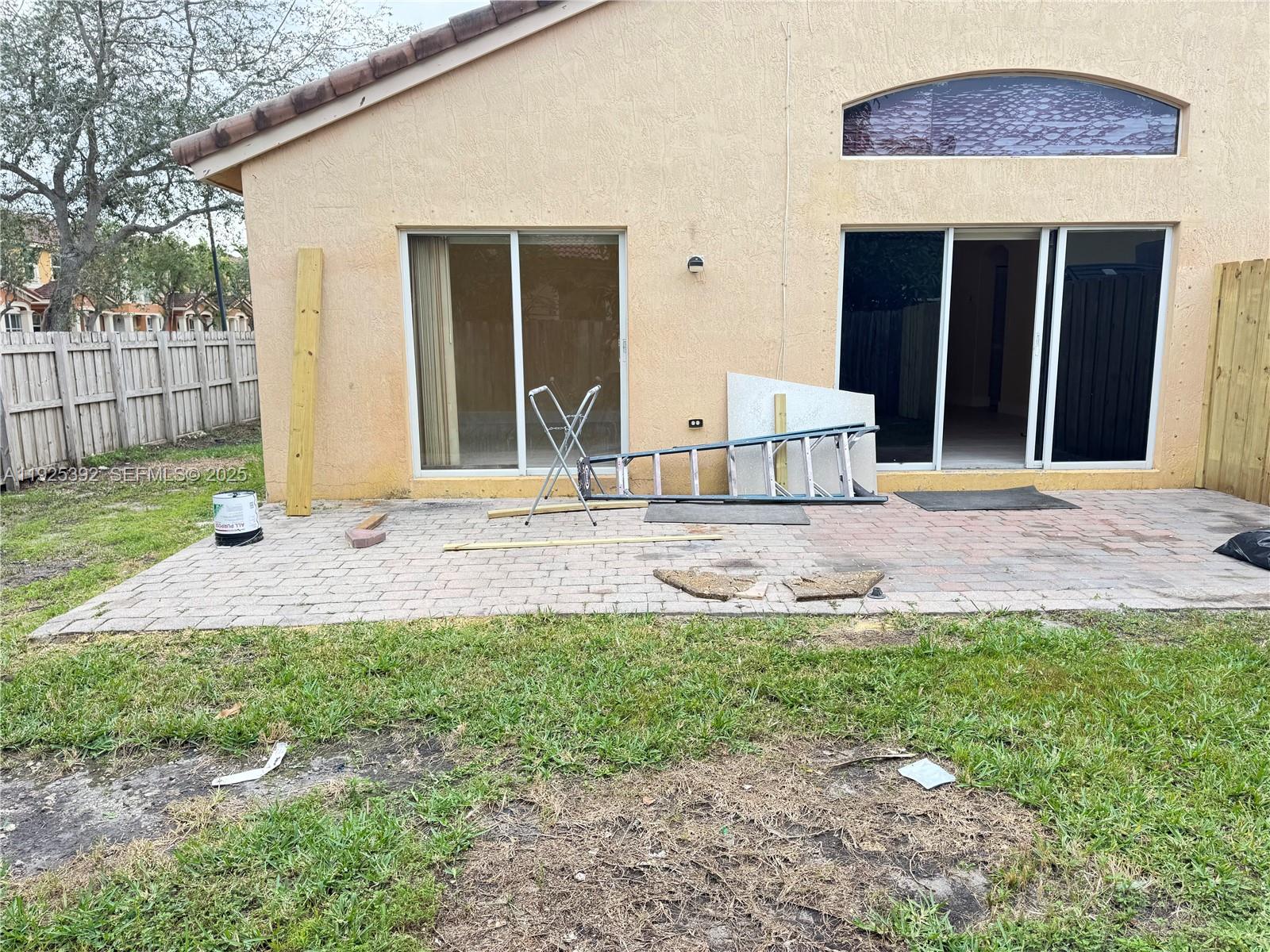 23953 Southwest 108th Court Homestead, FL 33032 - Photo 17 of 25 a front view of a house with garden