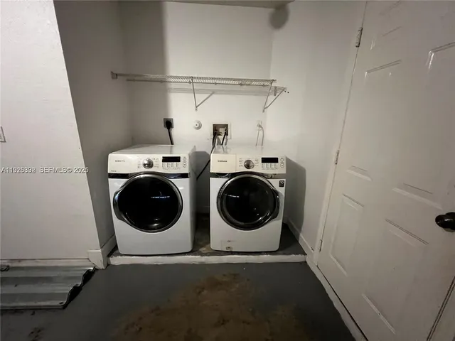 a backyard of a house with lots of green space and wooden fence