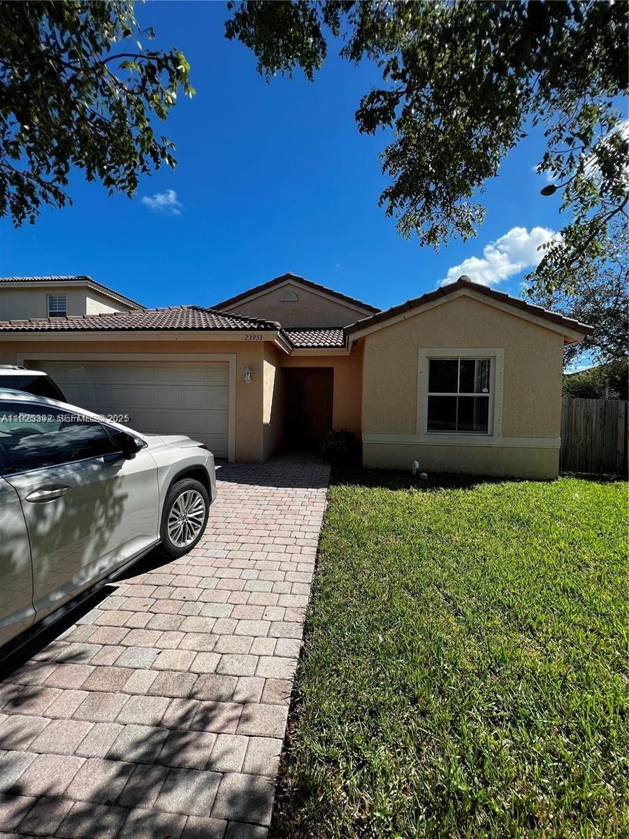 23953 Southwest 108th Court Homestead, FL 33032 - Photo 25 of 25 a front view of a house with garden