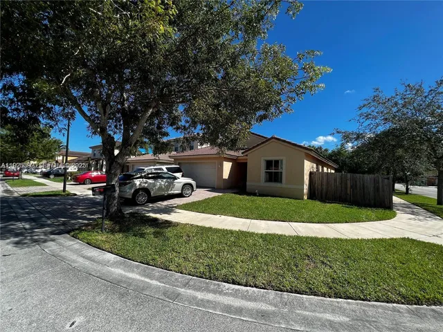 a house view with a garden space