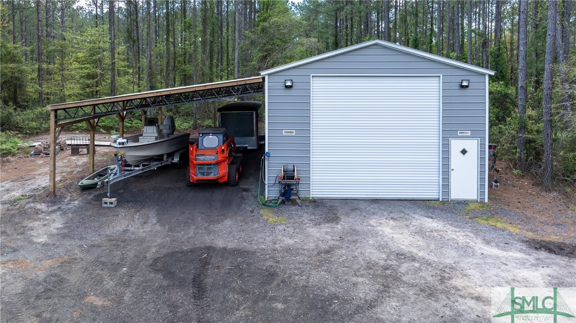 275 Kilkenny Road Richmond Hill, GA 31324 - Photo 2 of 50 Aerial drone of 24' x 40' shop with 24' x 40' lean