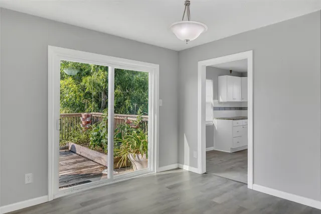 a kitchen with a refrigerator sink and cabinets