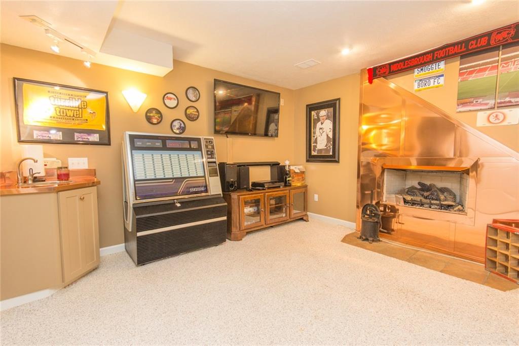 76 Firethorn Road Economy, PA 15005 - Photo 25 of 25 Gas fireplace and a wet bar in basement.
