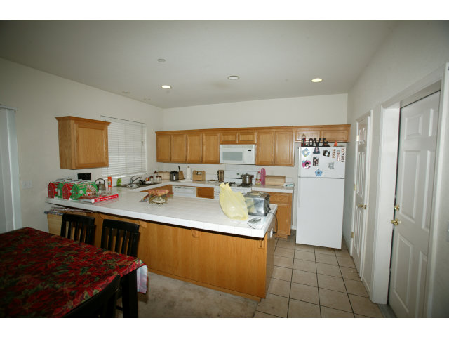 30 Chappel Loop Watsonville, CA 95019 - Photo 4 of 5 a kitchen with stainless steel appliances kitchen island sink refrigerator and stove