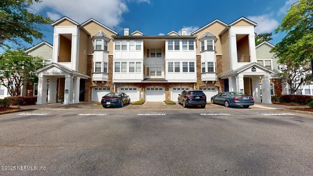 a view of a street that has couple of cars parked on the road