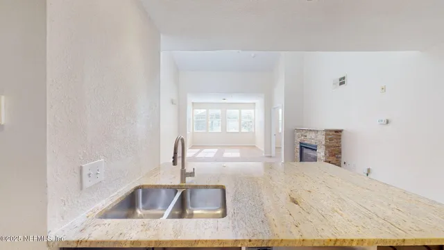 a kitchen with a sink and a window