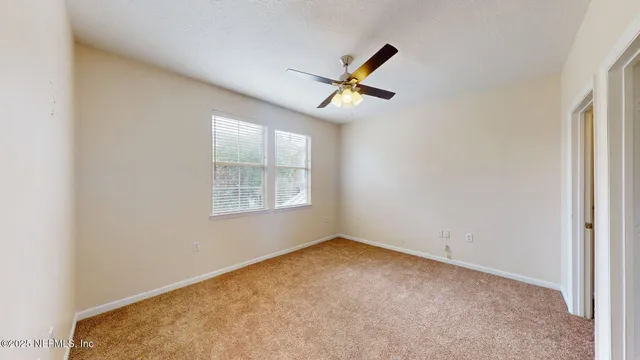 a view of empty room with windows