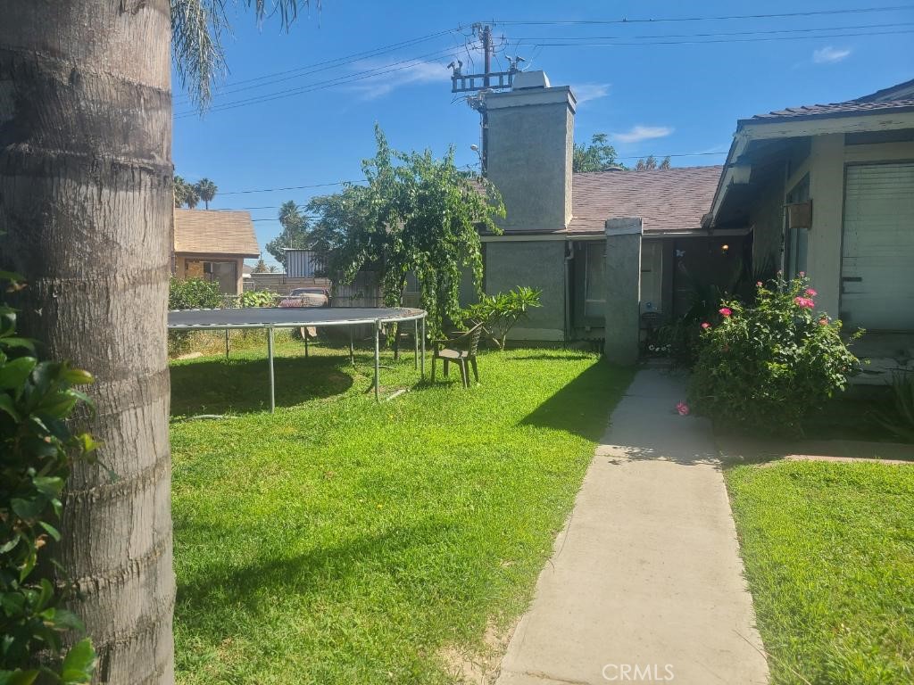 3872 Driving Range Road Riverside, CA 92509 - Photo 1 of 1 a view of a garden with a house in the background