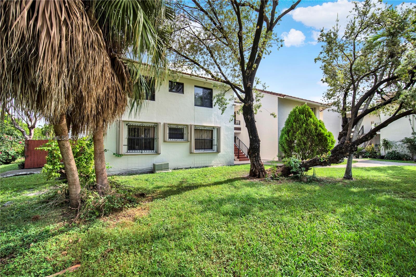 10857 Northwest 7th Street, Unit 2417 Miami, FL 33172 - Photo 2 of 35 a view of a house with a backyard