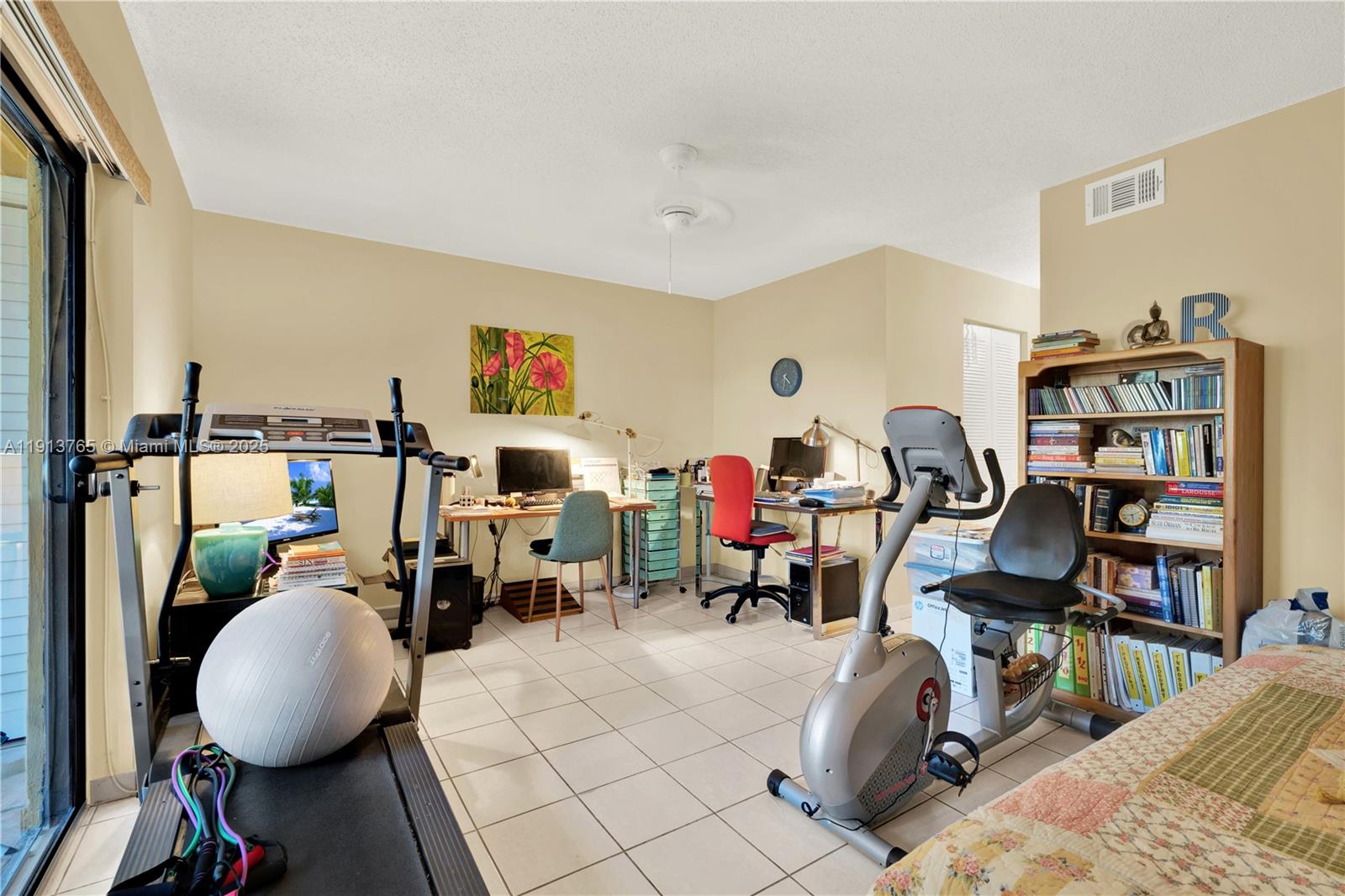 10857 Northwest 7th Street, Unit 2417 Miami, FL 33172 - Photo 30 of 35 a view of a workspace with furniture and toys