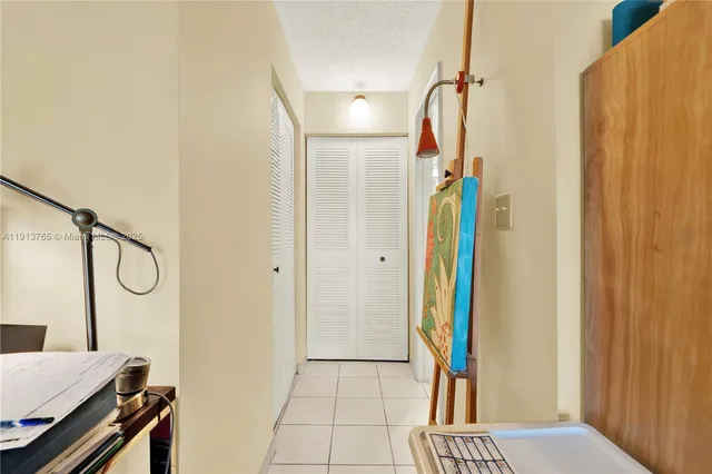 a bathroom with a toilet sink vanity and mirror