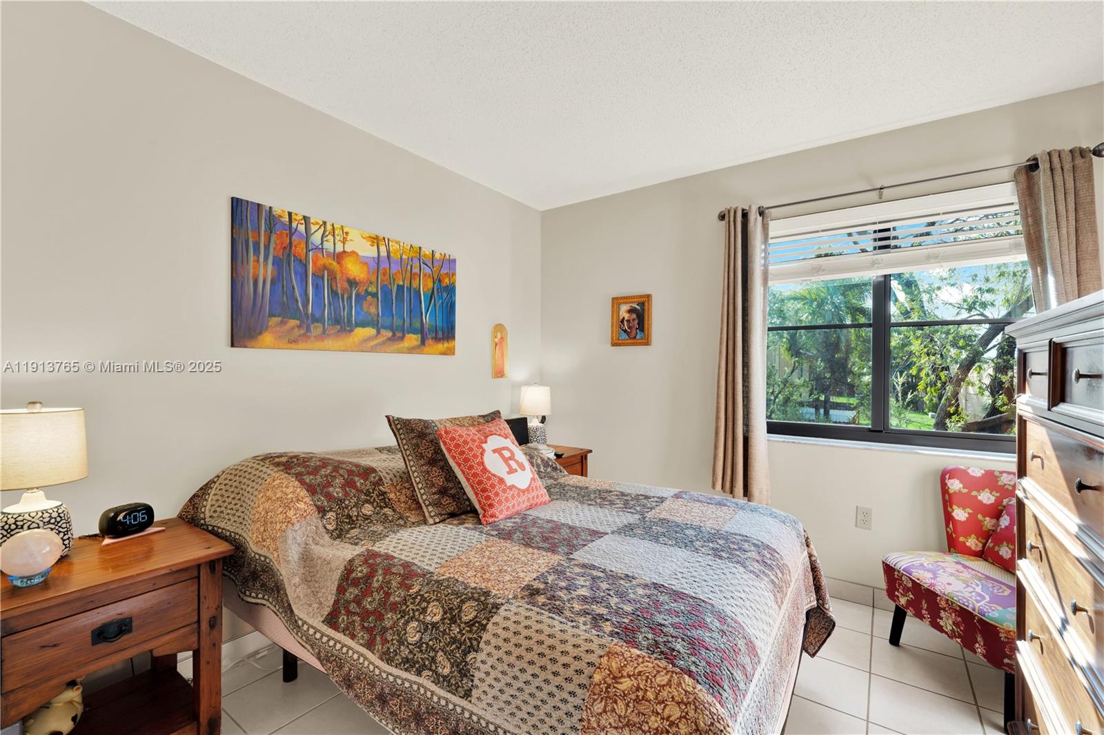 10857 Northwest 7th Street, Unit 2417 Miami, FL 33172 - Photo 34 of 35 a bedroom with a bed and a window