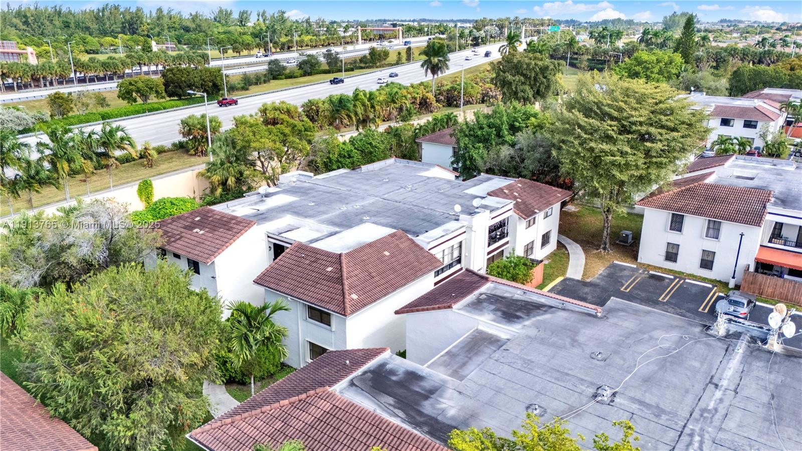 10857 Northwest 7th Street, Unit 2417 Miami, FL 33172 - Photo 4 of 35 an aerial view of a house with garden space and street view