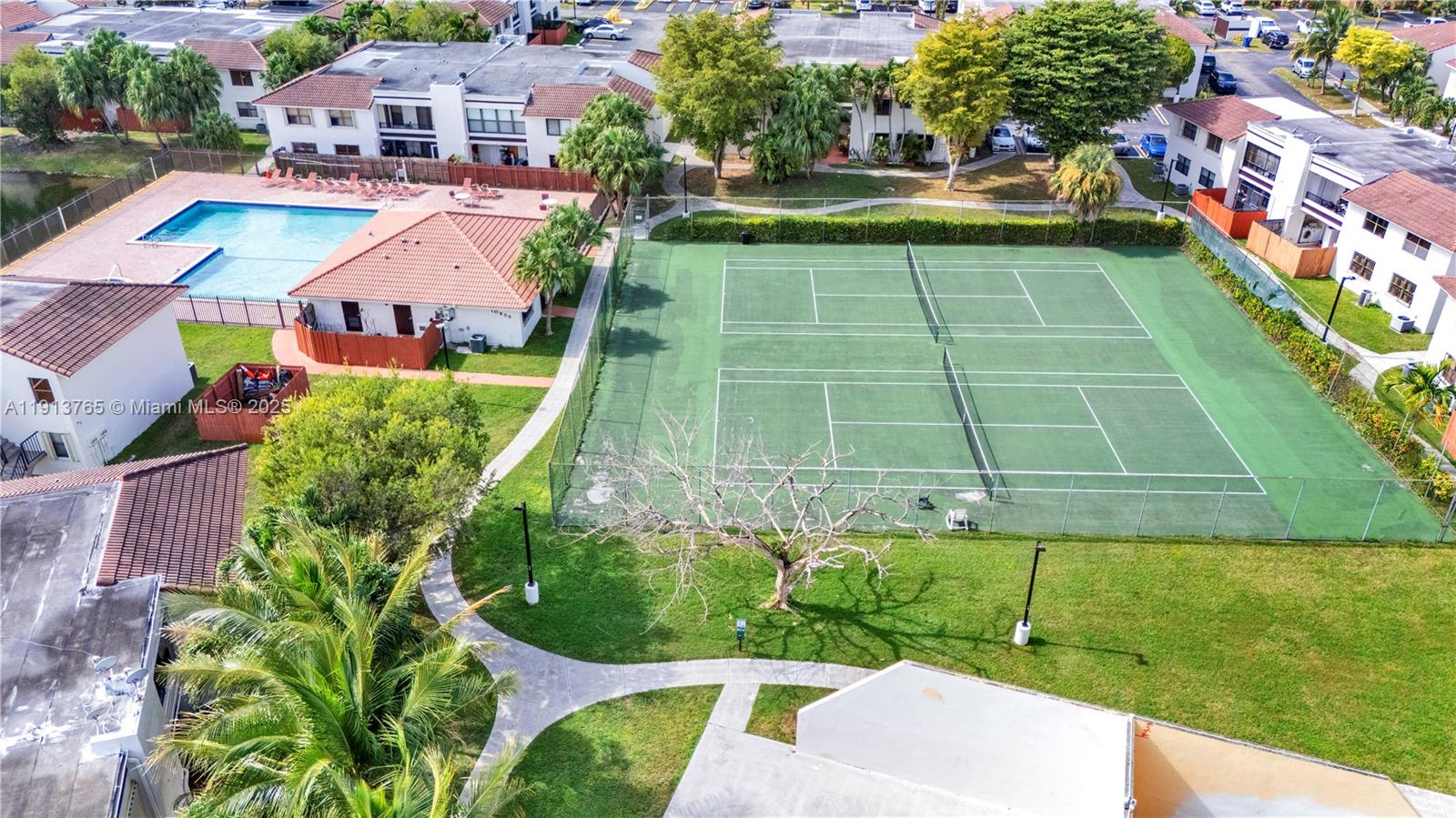 10857 Northwest 7th Street, Unit 2417 Miami, FL 33172 - Photo 5 of 35 a aerial view of a multi story residential apartment building with a yard
