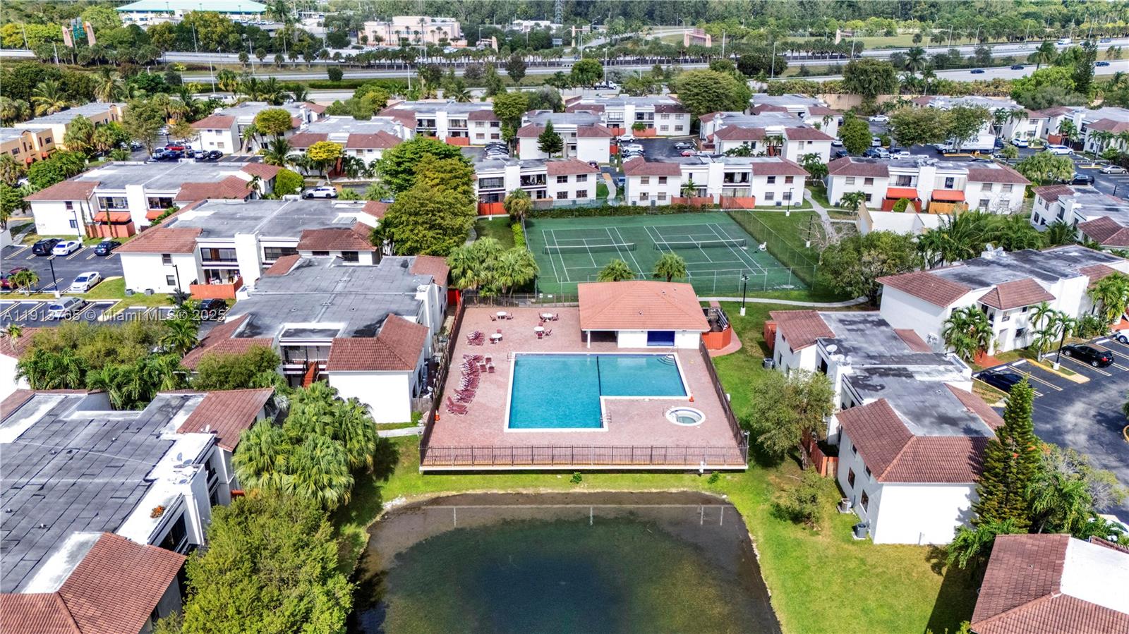 10857 Northwest 7th Street, Unit 2417 Miami, FL 33172 - Photo 6 of 35 an aerial view of a house with a garden