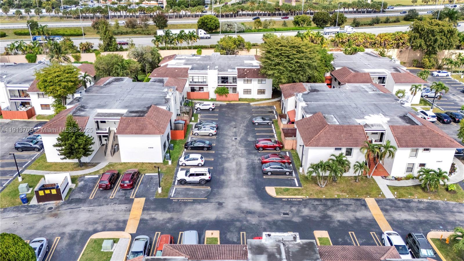 10857 Northwest 7th Street, Unit 2417 Miami, FL 33172 - Photo 9 of 35 an aerial view of residential houses and outdoor space