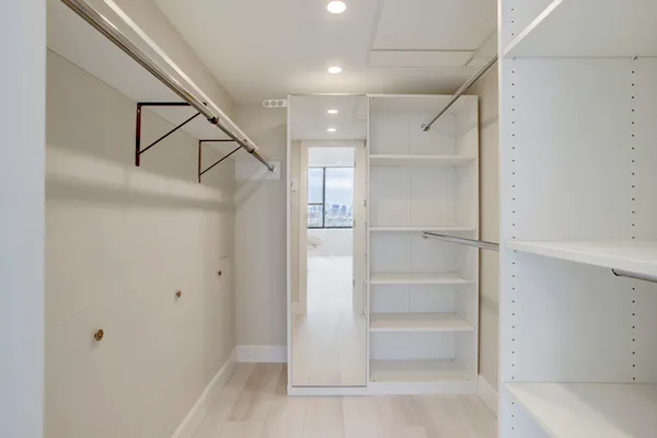 a view of an empty walk in closet