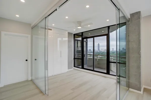 a bathroom with a glass door shower