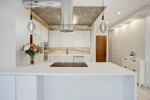 a kitchen with a sink and refrigerator