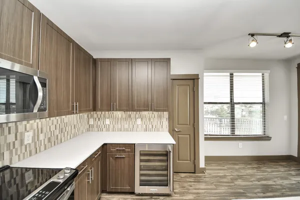 a view of a livingroom with a ceiling fan and window