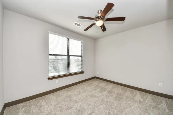 a view of a patio with table and chairs with wooden floor and fence