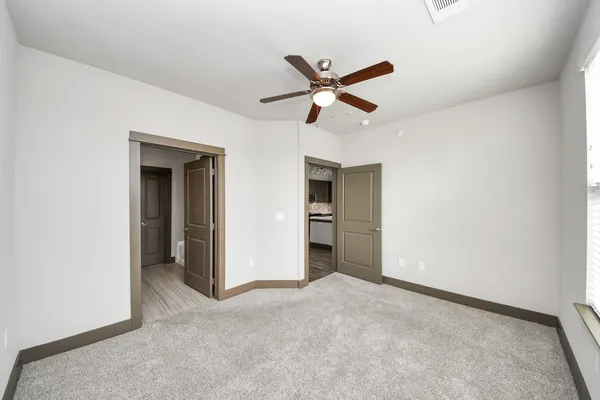 a view of a patio with a table chairs and a backyard