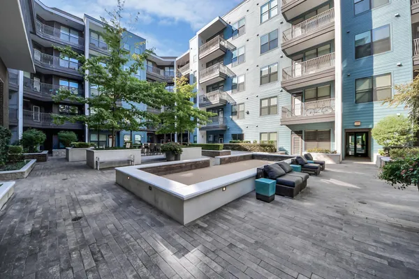 a bathroom with a sink a vanity and a large mirror