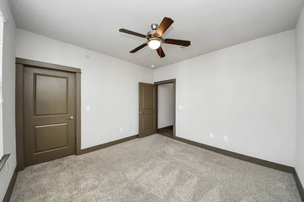 a bathroom with a glass shower door